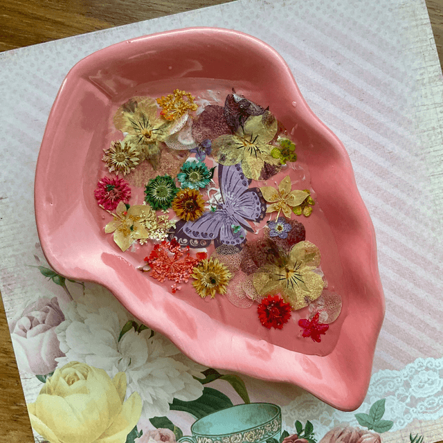 Pink leaf ring trinket tray with pressed flowers.