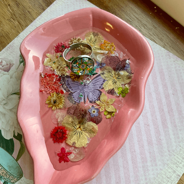 Pink leaf ring trinket tray with pressed flowers.