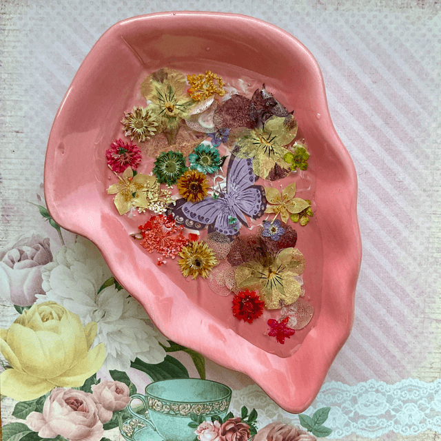 Pink leaf ring trinket tray with pressed flowers.