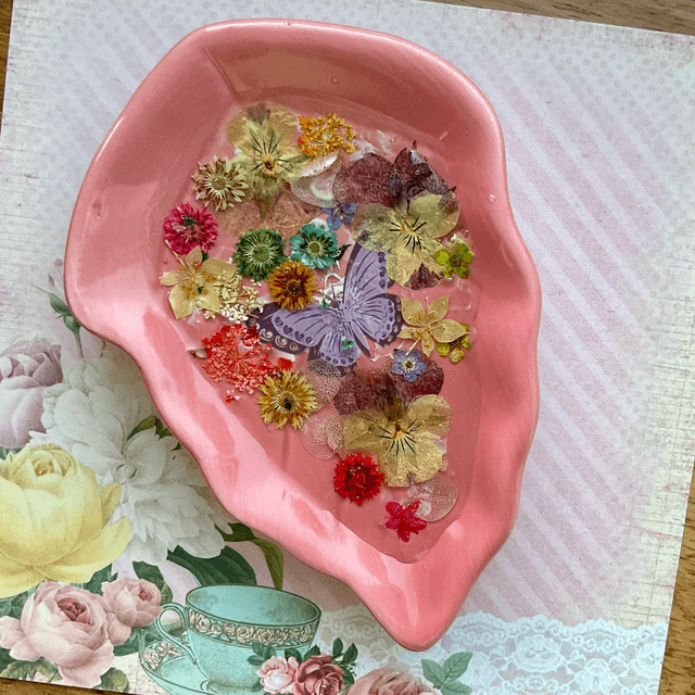Pink leaf ring trinket tray with pressed flowers.