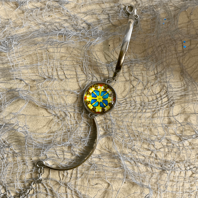 Handmade bracelet with colourful glass cabochon.