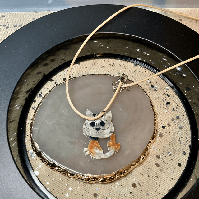Handmade necklace with cute cat’s pendant.