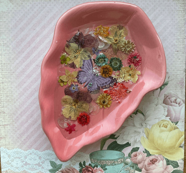 Pink leaf ring trinket tray with pressed flowers.