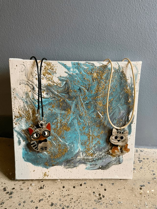 Handmade necklace with cute cat’s pendant.