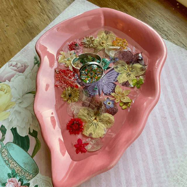 Pink leaf ring trinket tray with pressed flowers.