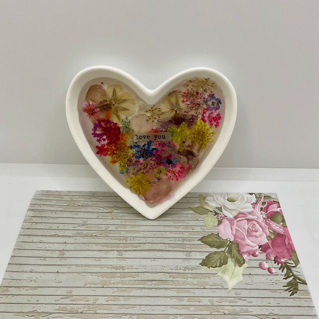 White porcelain ring trinket with pressed flowers in resin.