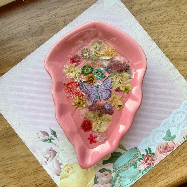 Pink leaf ring trinket tray with pressed flowers.