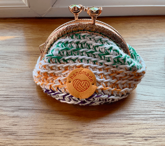 Handmade crochet coin purse. Rainbow design.