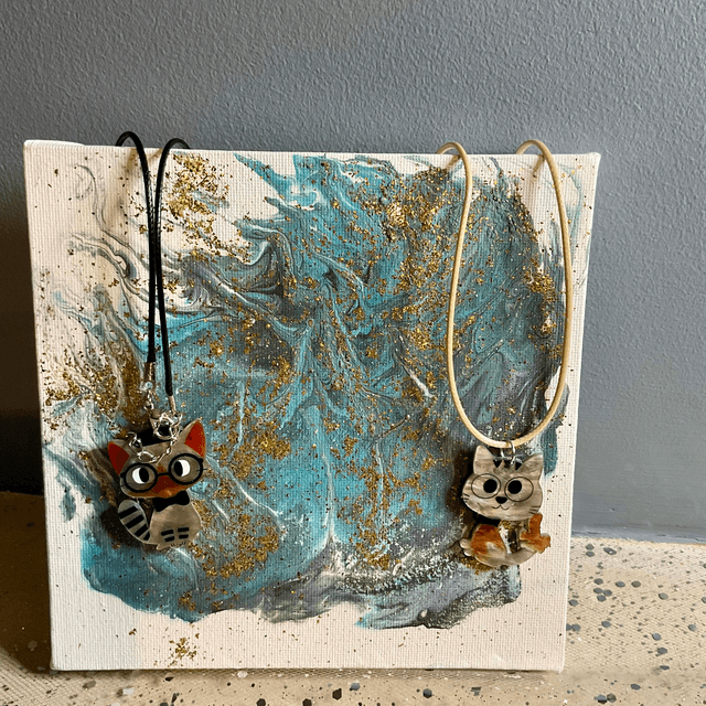 Handmade necklace with cute cat’s pendant.
