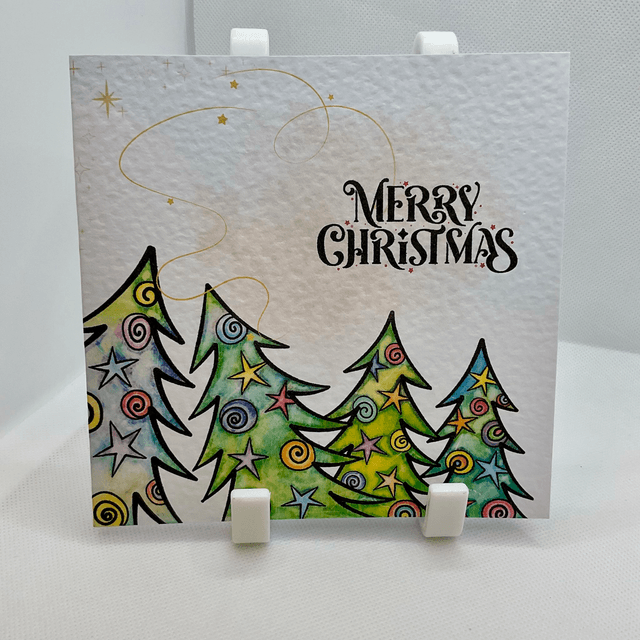 Personalised Christmas card. Colourful Christmas’s trees.