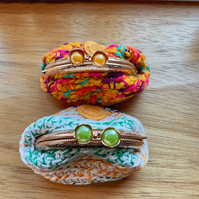 Handmade crochet coin purse. Rainbow design.