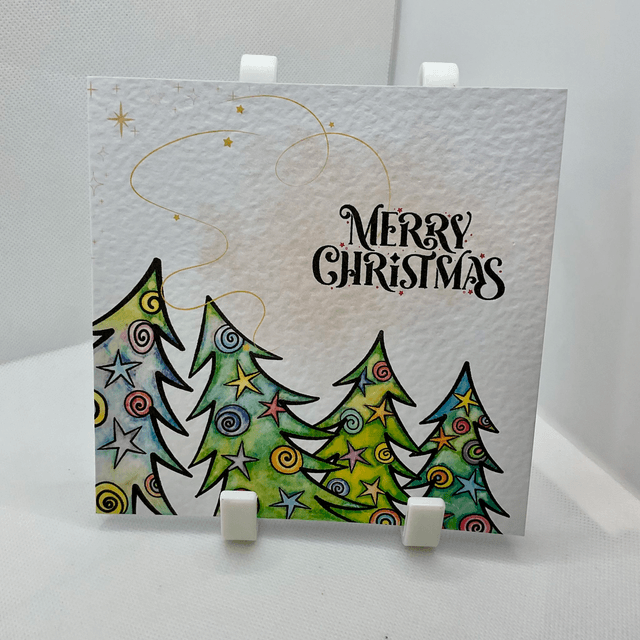 Personalised Christmas card. Colourful Christmas’s trees.