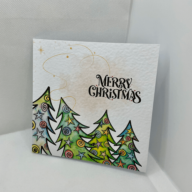 Personalised Christmas card. Colourful Christmas’s trees.