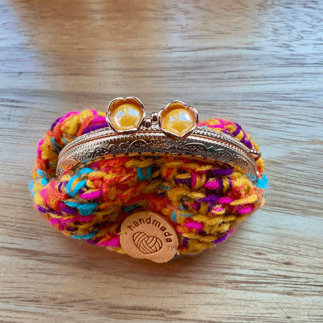 Handmade crochet coin purse. Rainbow design.